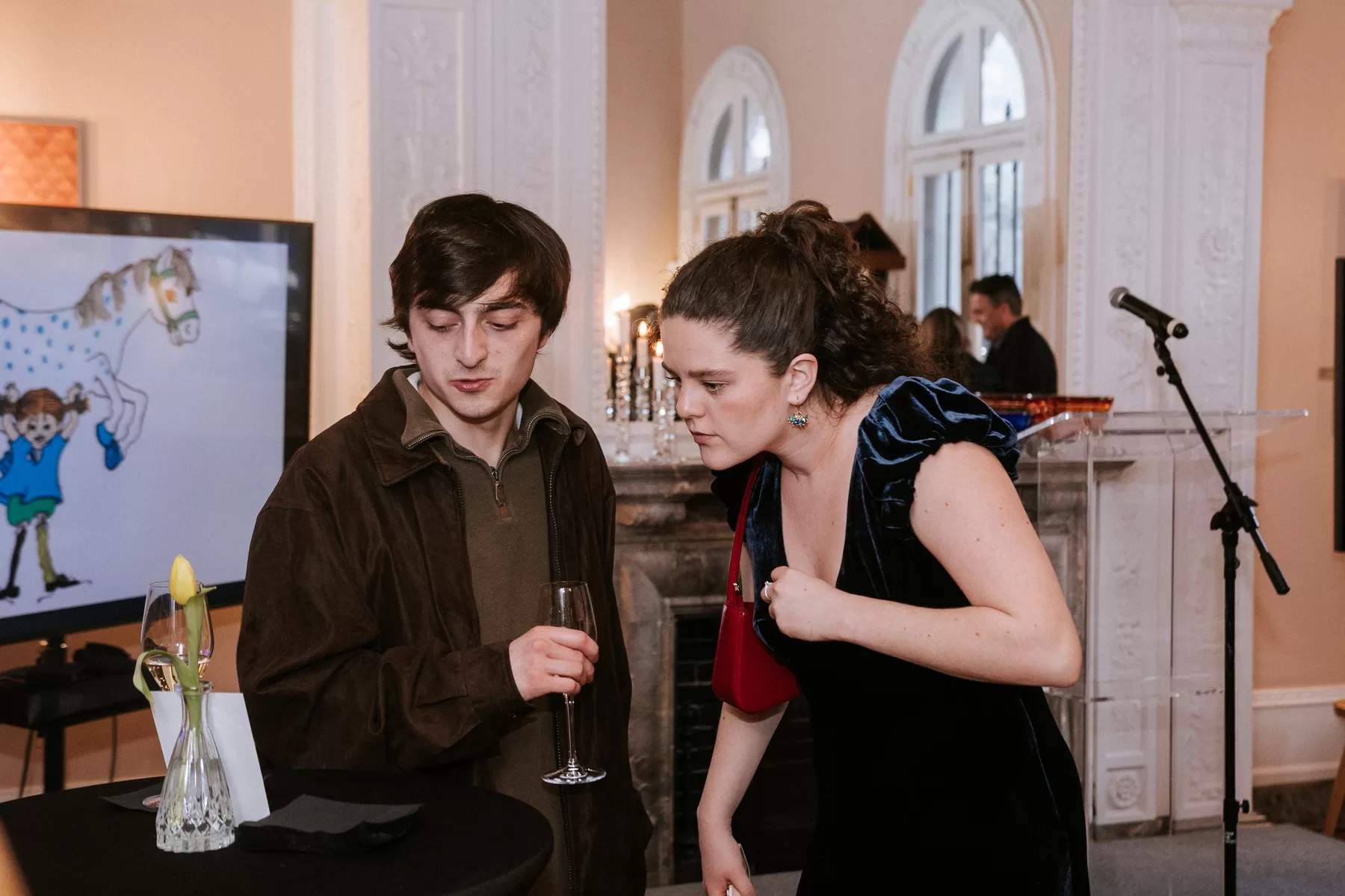 Guests sharing a candid conversation at an event