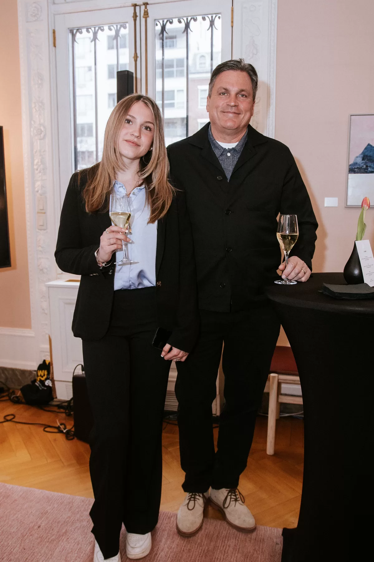 Two attendees posing together at a corporate gathering