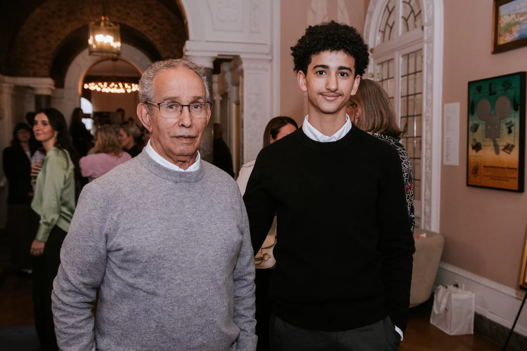 Two guests sharing a relaxed moment at an event