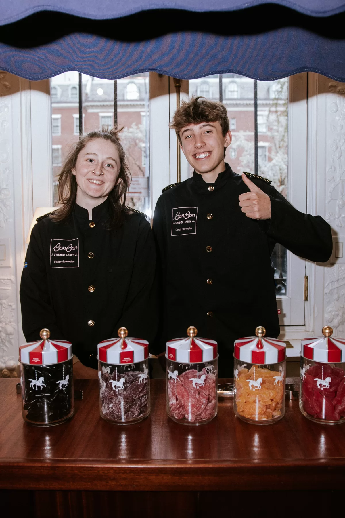 Brand representatives standing behind a product display