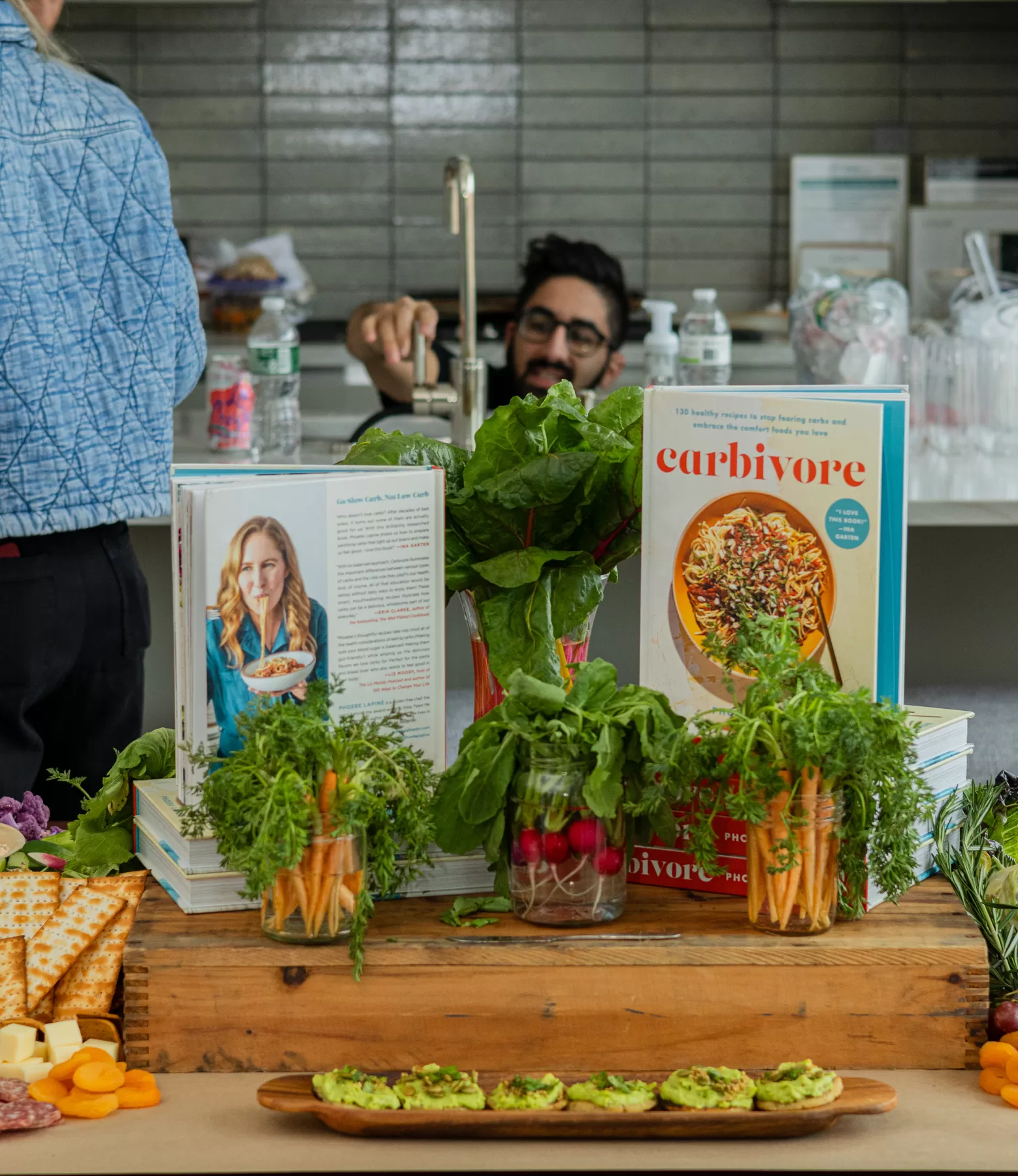 Branded cookbook and food display at a launch event