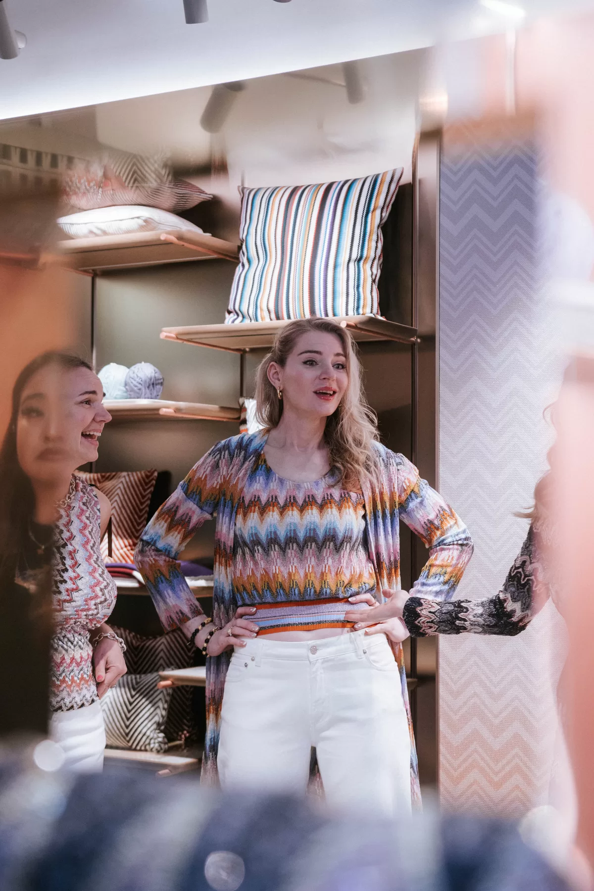 Guest photographed candidly inside a fashion boutique