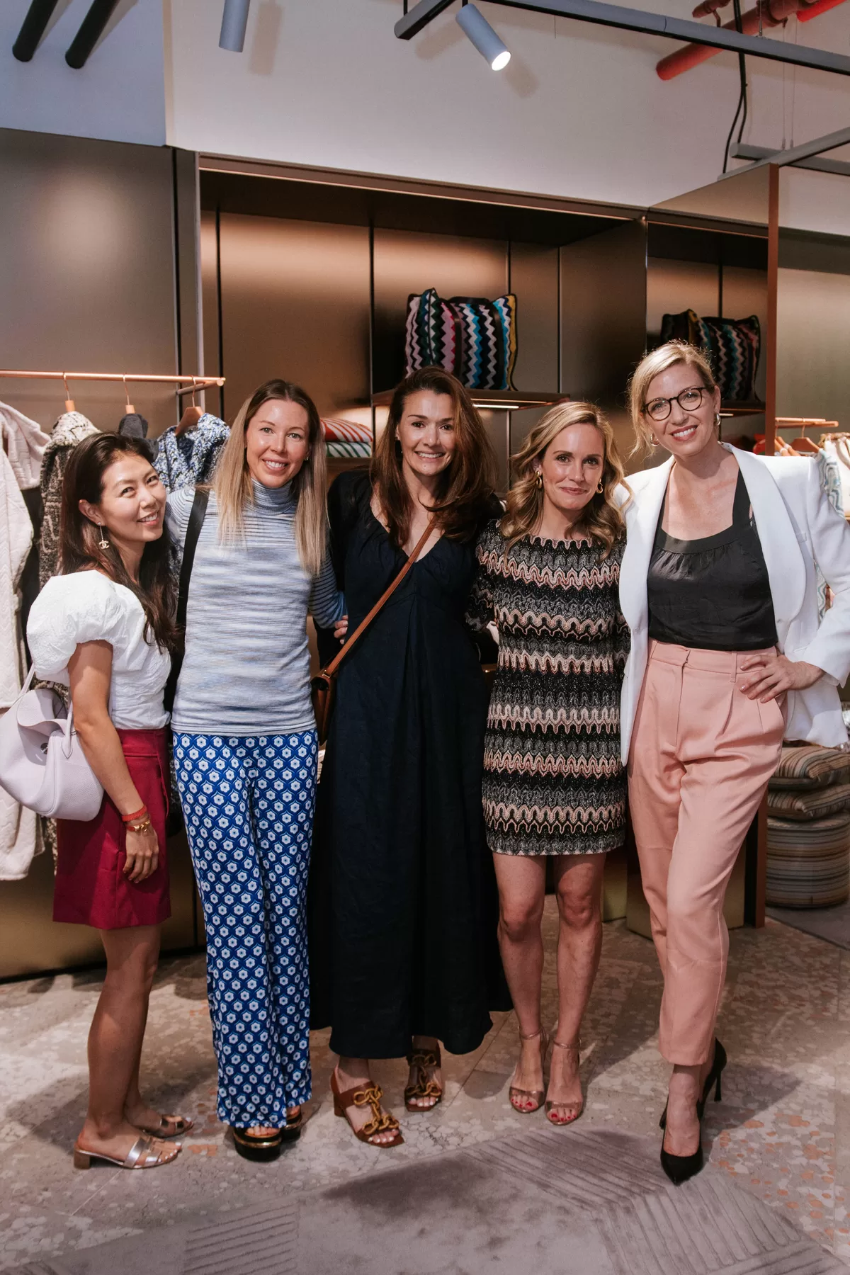 Group of attendees gathered at a fashion event