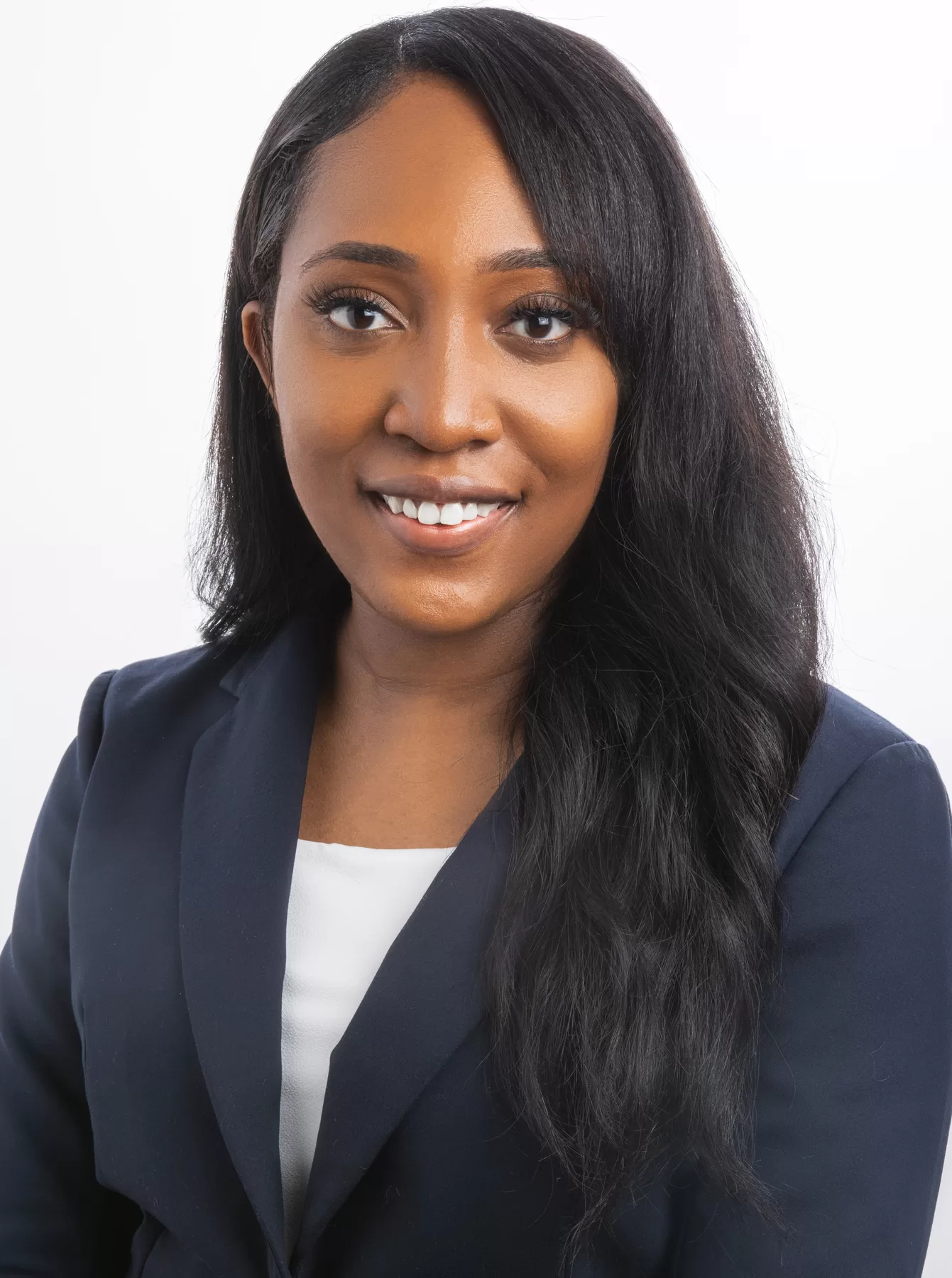 Executive female headshot in a navy blazer