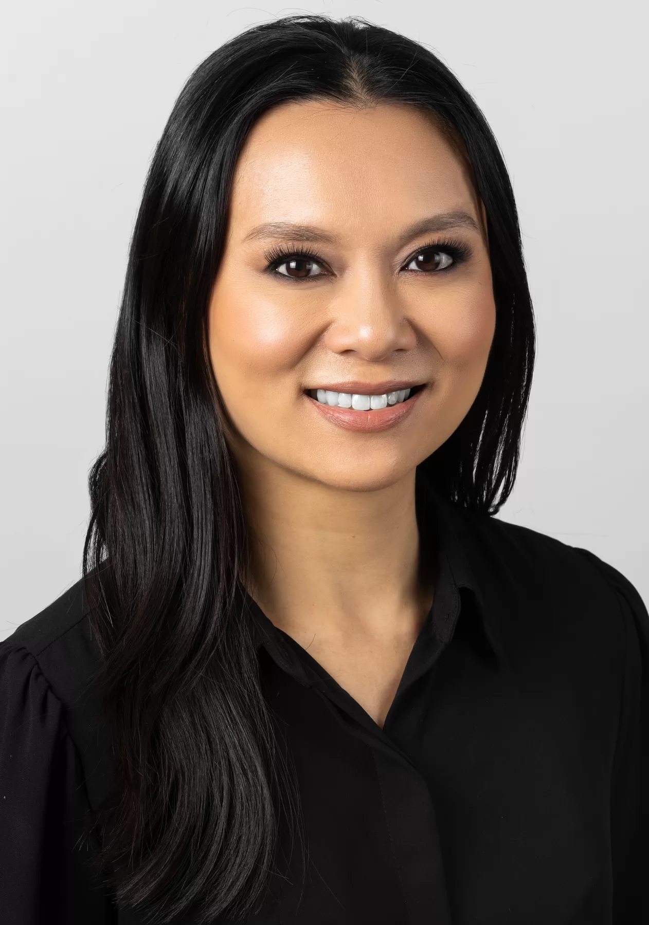 Professional female headshot in a black blouse