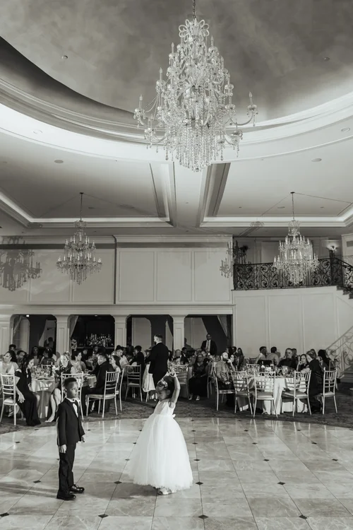 Newlyweds photographed inside an elegant ballroom