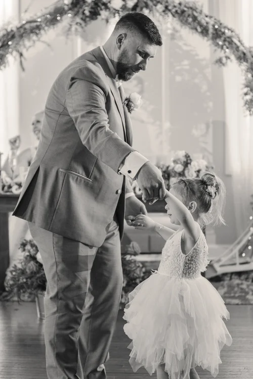 Bride walking through a colorful garden