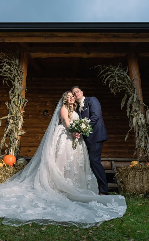 Editorial wedding portrait framed by a dark doorway