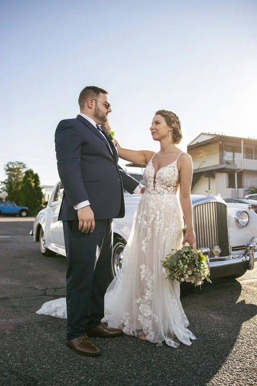 Bride and groom sharing a quiet outdoor portrait