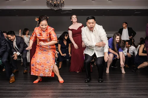 Guests dancing together at a wedding reception